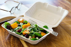 Pumpkin and spinach salad in medium clamshell packaging