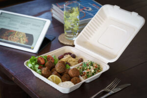 15. Tabouli, hummus, salad and falafel in clamshell packaging